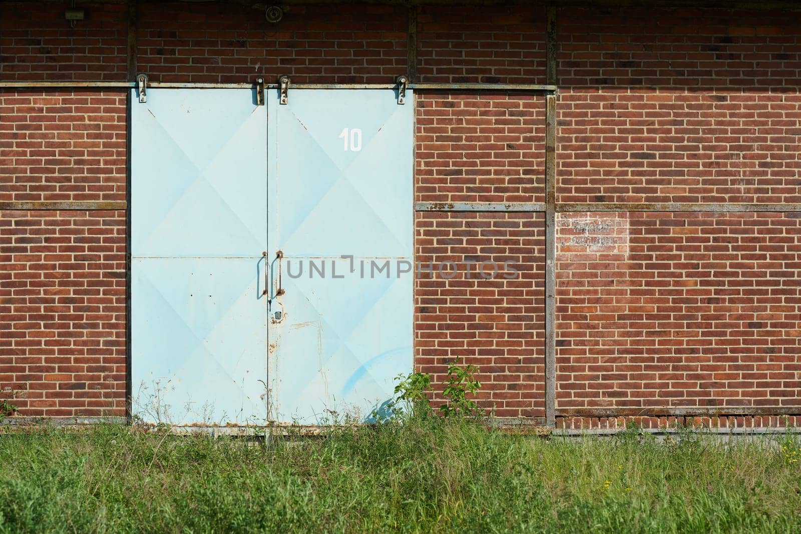 blue metal gate to a warehouse in the port of Magdeburg, Germany