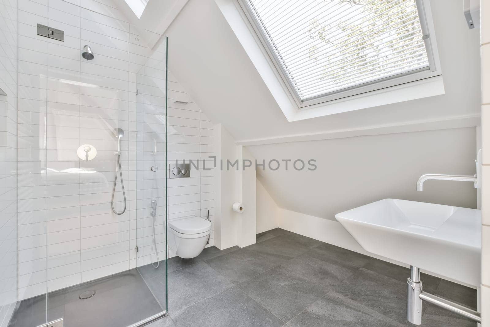a modern bathroom with skylights and white tile flooring in an attic - style home, designed to look like it's