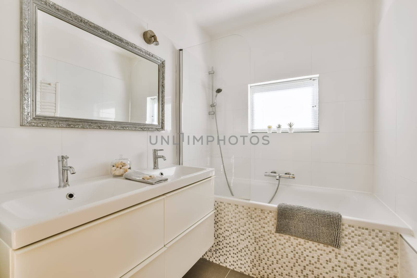 a bathroom with a sink, mirror and bathtub in the same color as it appears on the wallpaper