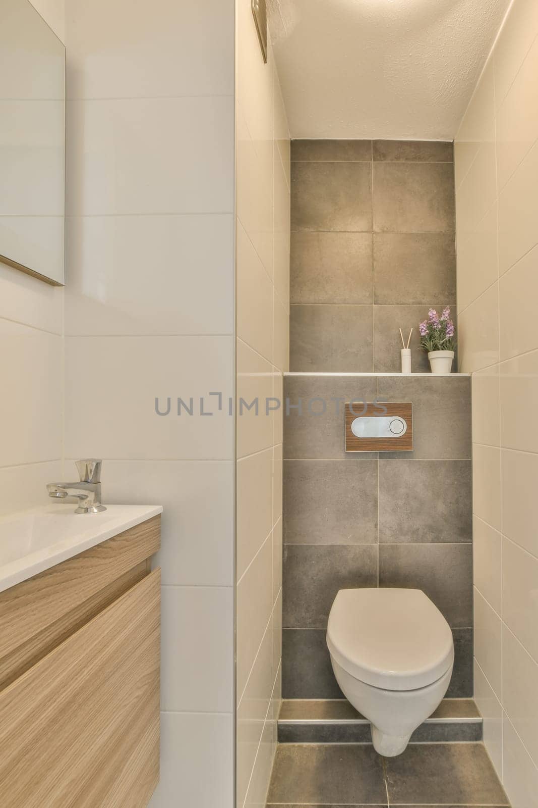 a bathroom with a toilet in the corner and a sink on the other side next to the wall is a mirror