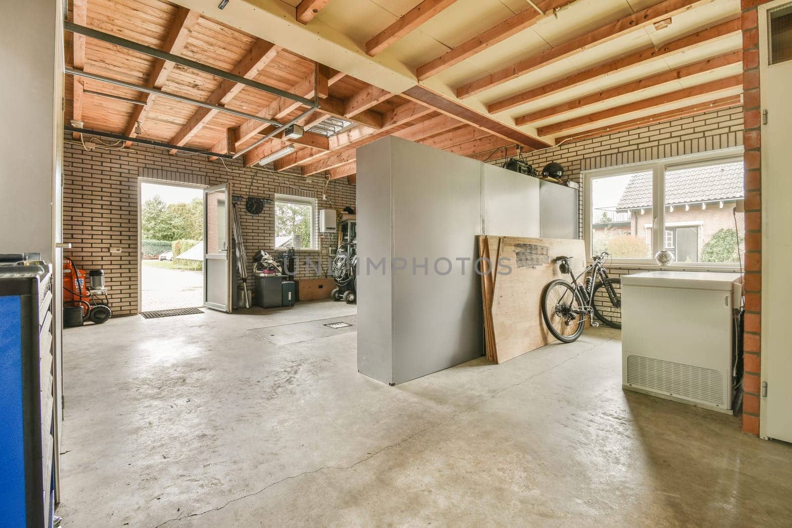 the inside of a building with exposed ceilings and wood beams on the ceiling, while it's not in use