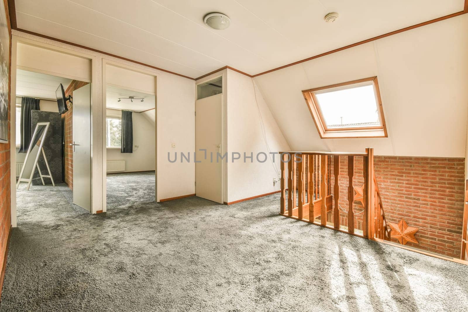 the inside of a house with no windows or doors, and an open door leading to another room that is not in use