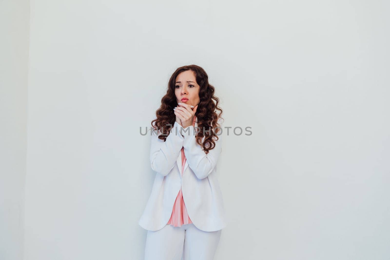 brunette woman pondering on white office background