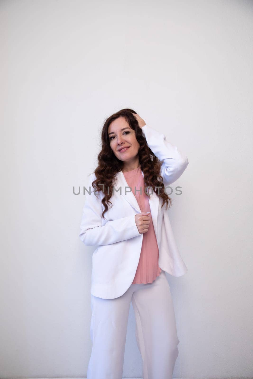 brunette woman smiling on white office background