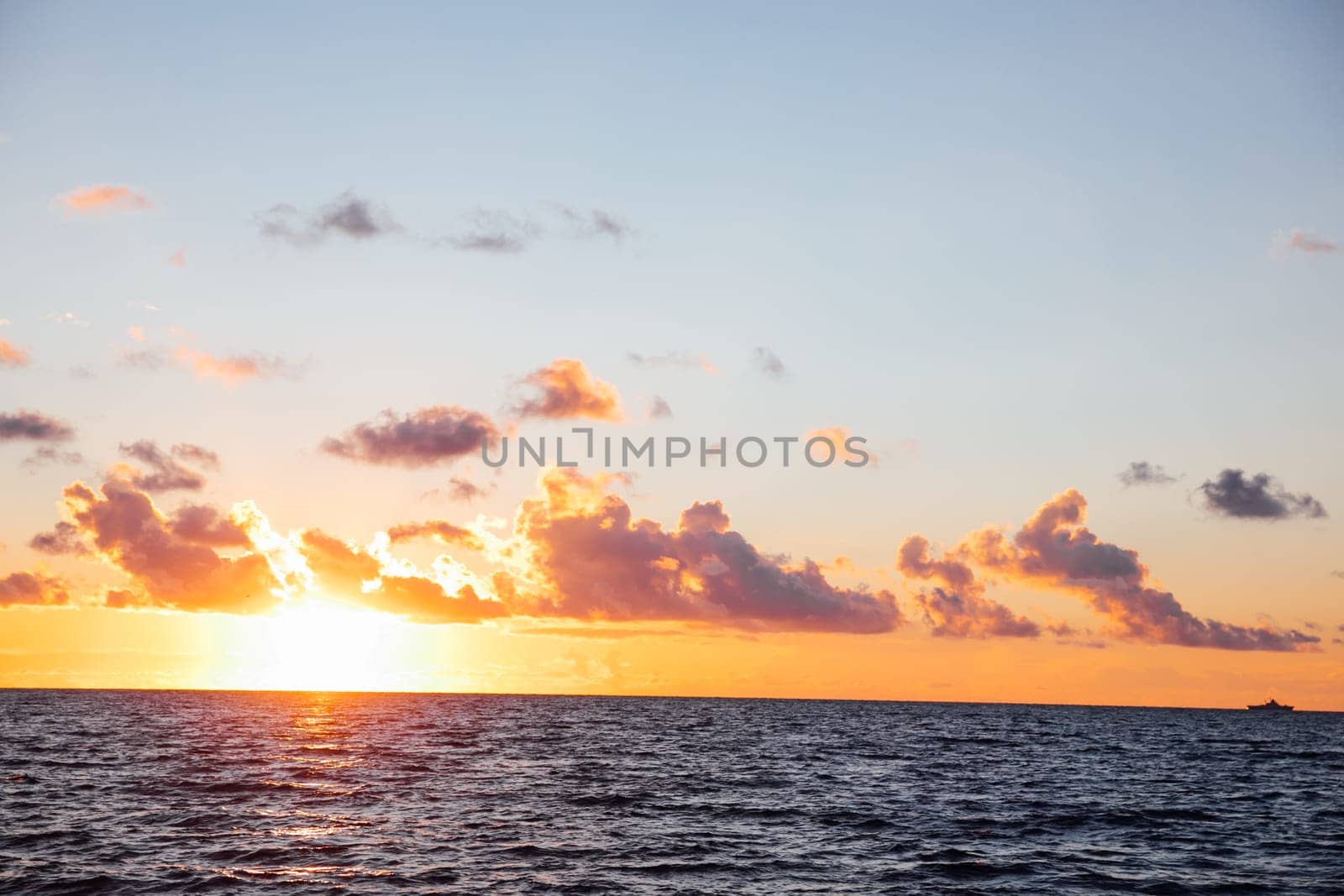 Beautiful landscape sea with waves and clouds at sunset