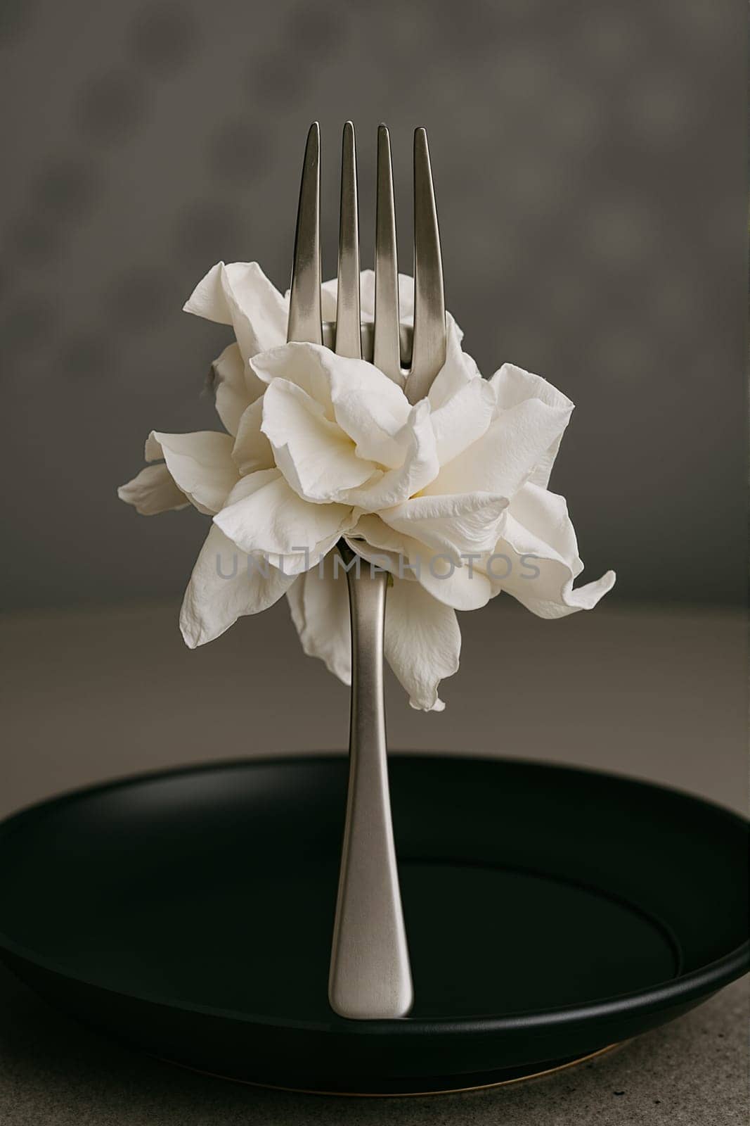 White flower with fork on black background, AI generation.