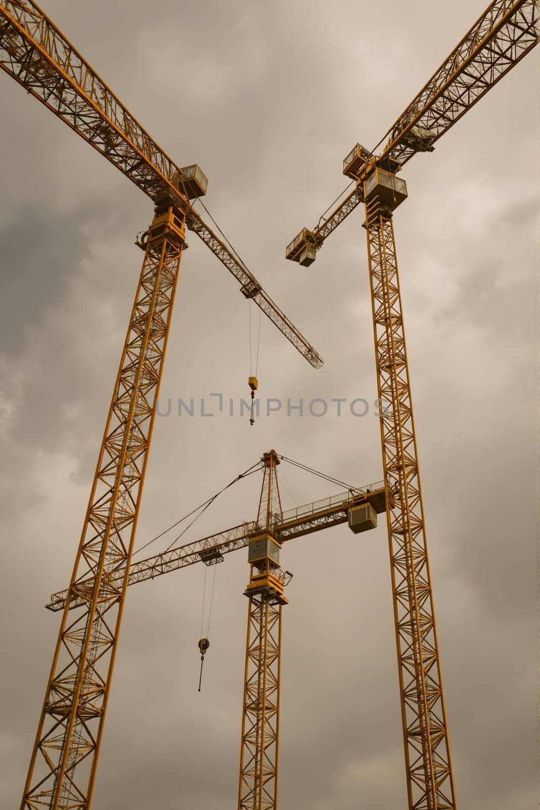 Construction cranes in landscape, AI generation.
