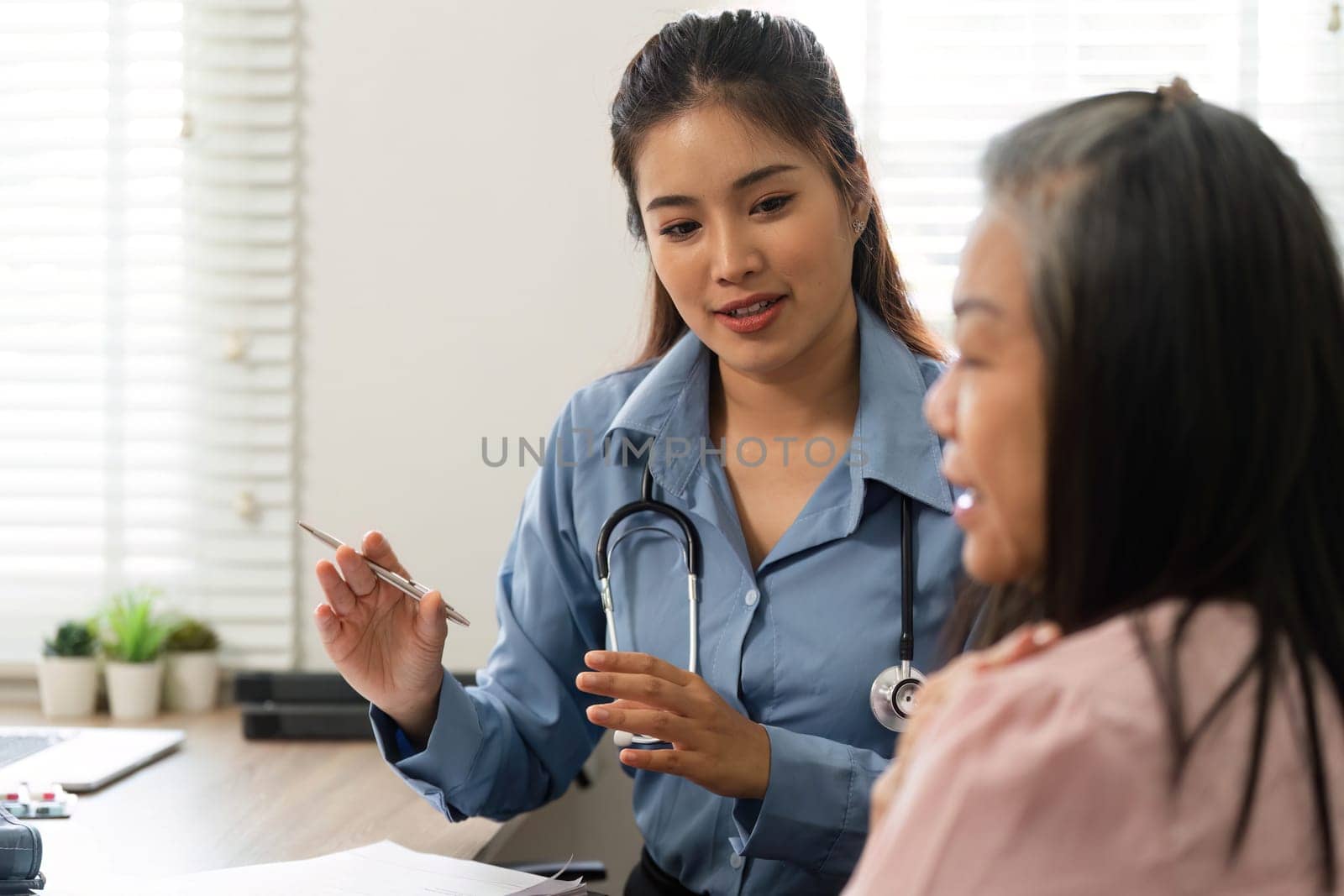A healthcare professional engages in a meaningful conversation with a senior patient, ensuring clarity and understanding of medical advice.