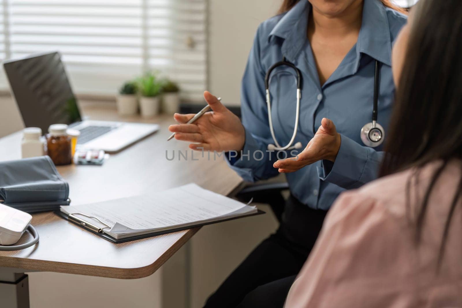 The nurse provides valuable insights into health issues, demonstrating care and professionalism during the patient consultation.