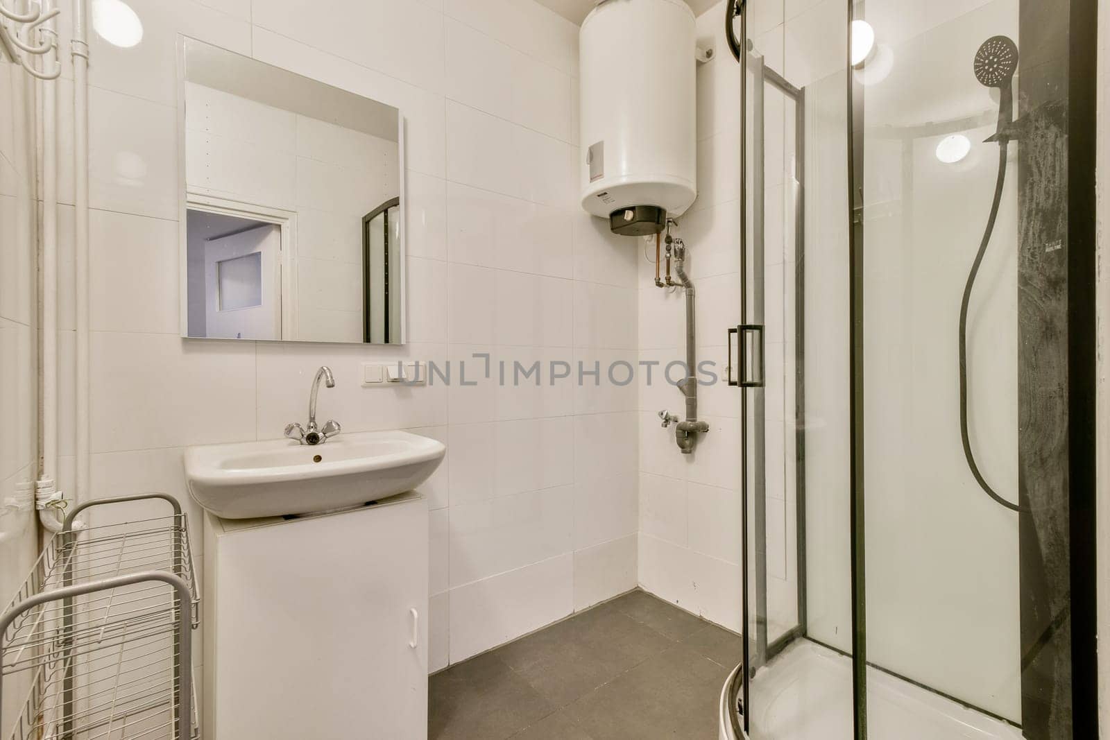 A sleek and modern bathroom featuring clean lines, a compact sink, an elegant shower, and a minimalistic design. Perfect for contemporary living spaces.