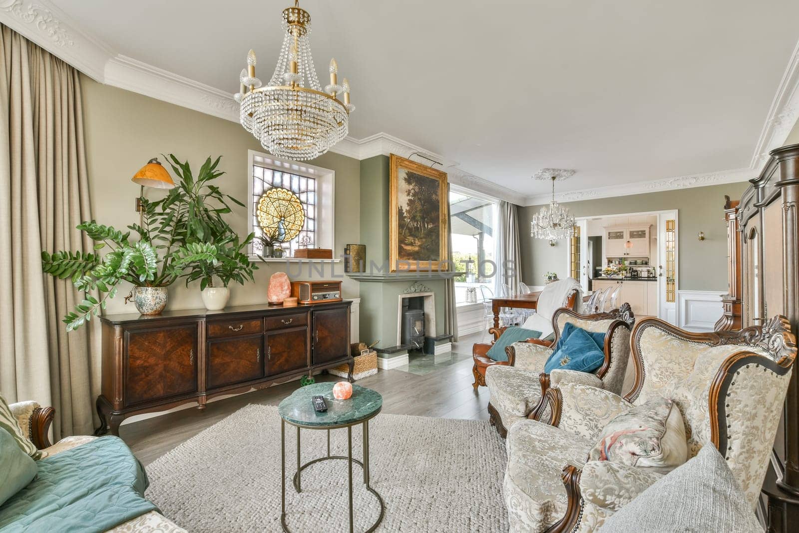 A beautifully designed vintage living room showcasing classic furniture, decorative plants, and a luxurious chandelier, creating a warm and inviting atmosphere.