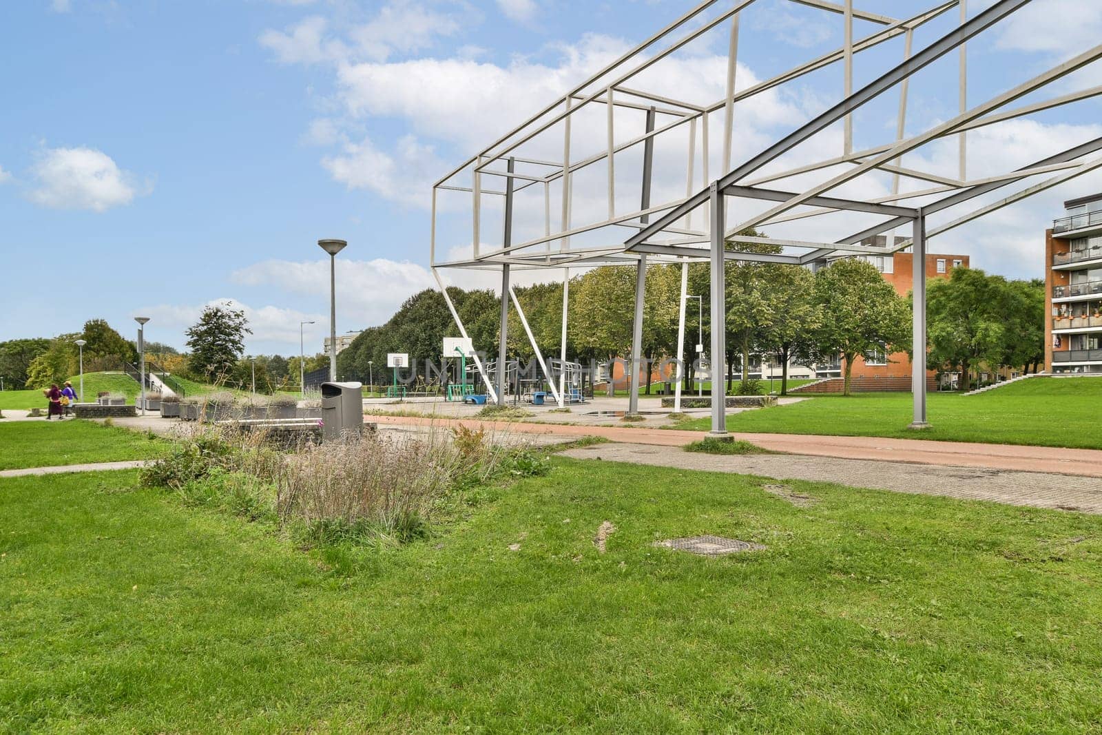 A vibrant modern park showcasing unique architectural elements, lush green areas, and recreational facilities for community enjoyment.
