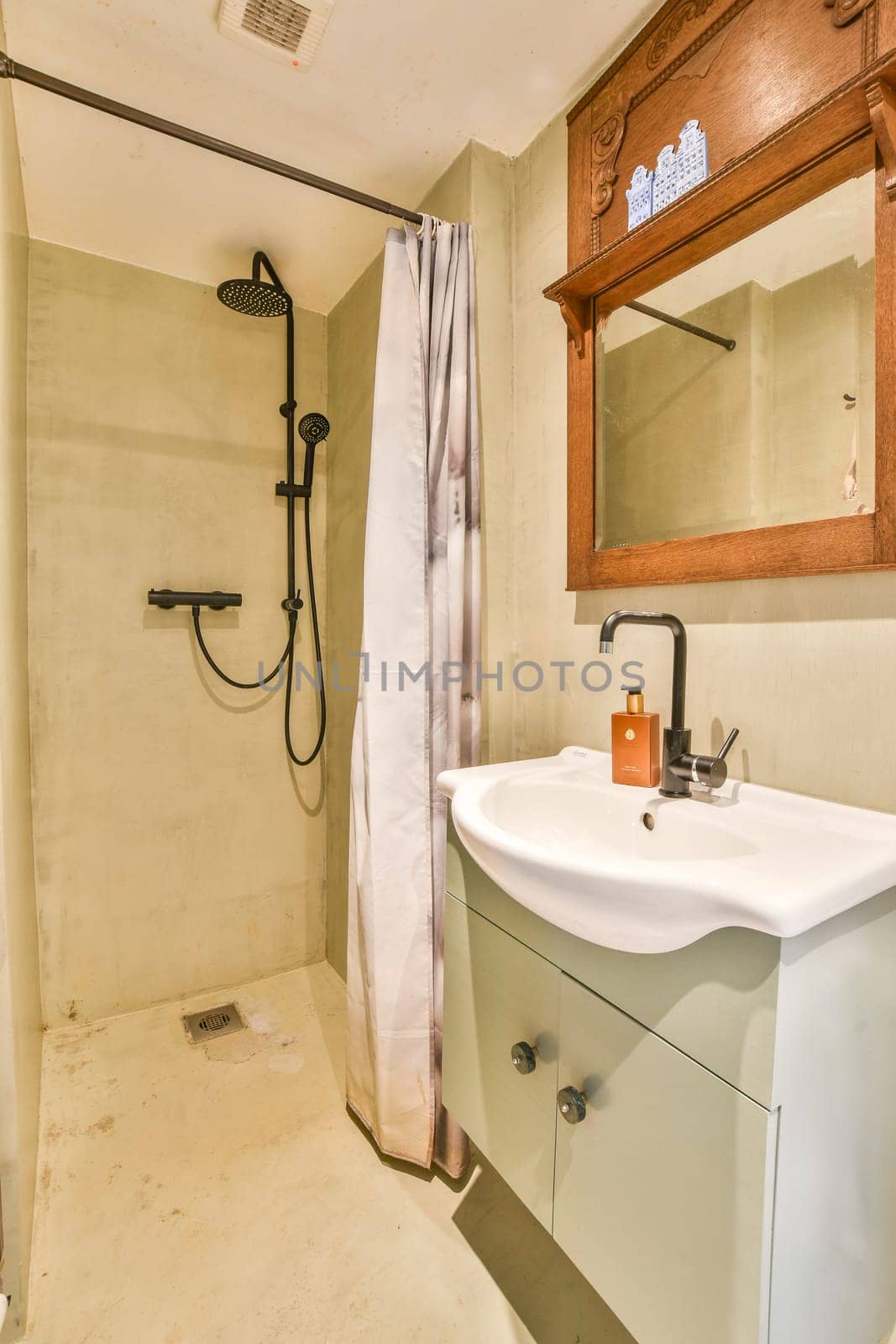 A spacious modern bathroom featuring a well-lit shower area, elegant vanity, and minimalist design elements to create a calm ambiance.