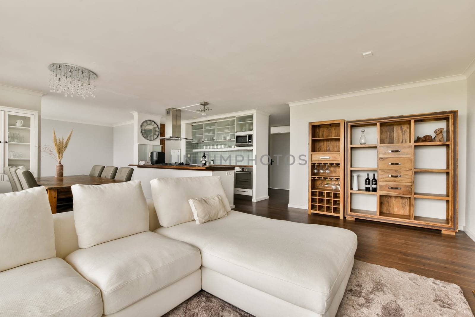 A contemporary living room showcasing a cozy seating area, elegant decor, and vibrant elements, perfect for relaxation and entertainment.
