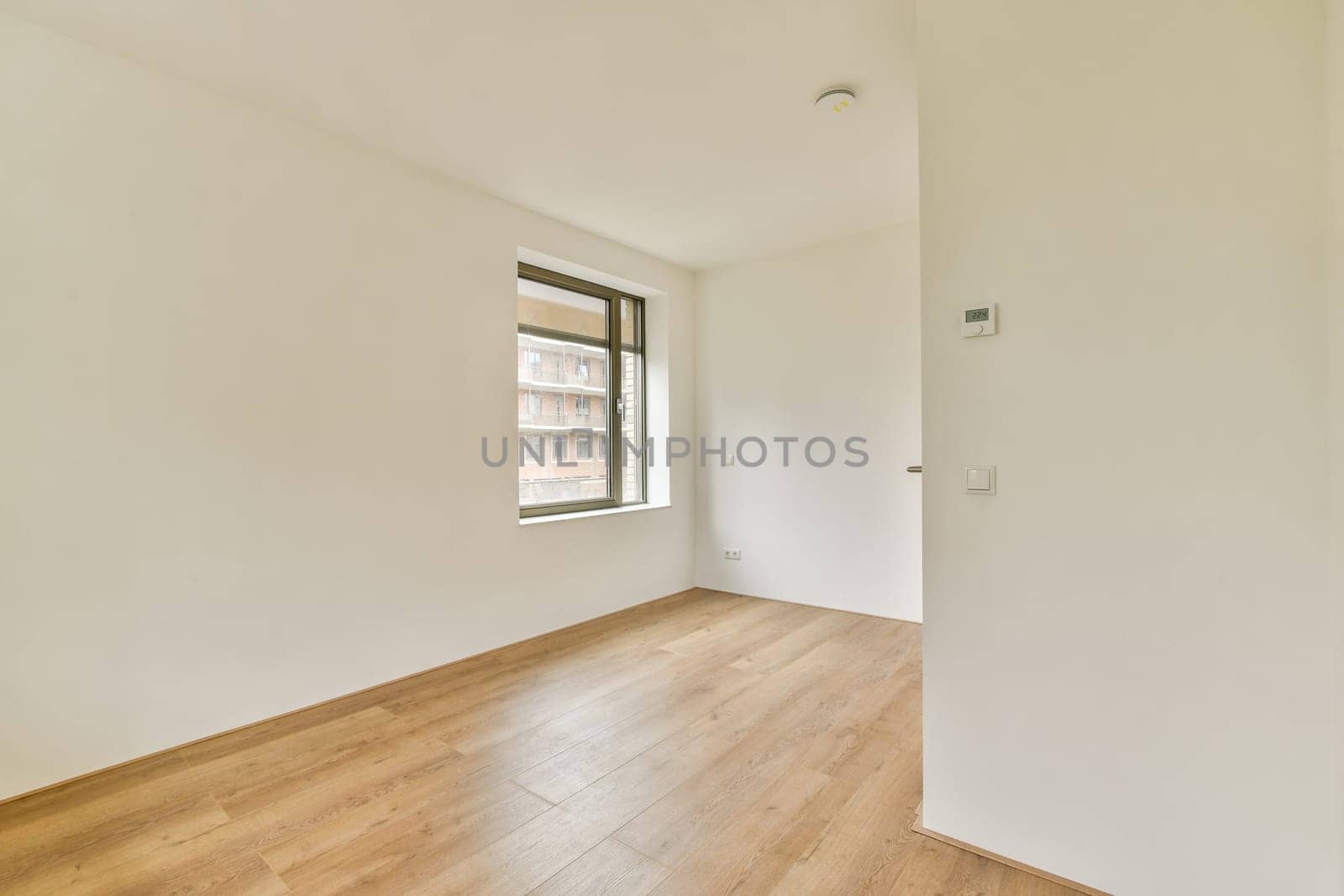 Bright and spacious room featuring clean lines and a neutral color palette, emphasizing simplicity and functionality in modern interior design.