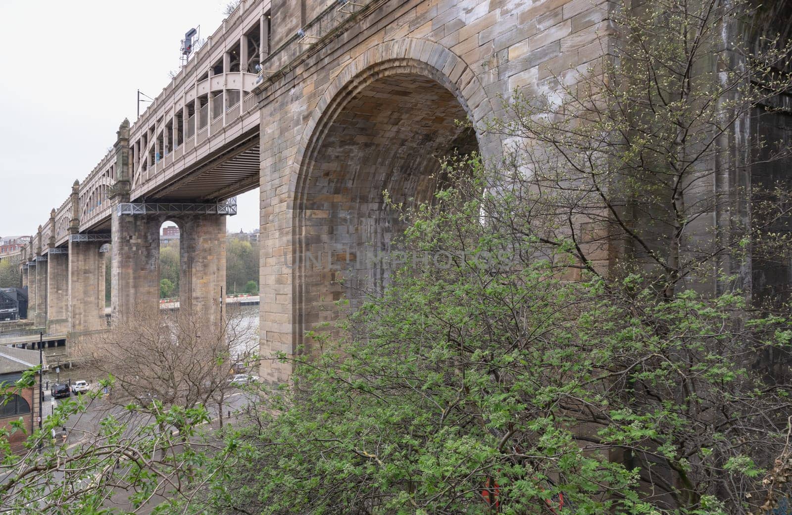 Newcastle, UK - Apr 12, 2025 - A view of The High level bridge (Railway viaduct) is a road and railway bridge spanning the River Tyne connecting Newcastle upon tyne and Gateshead in Newcastle Upon Tyne in the North East of England. use it as your Wallpaper, Poster and Space for text, Selective focus.