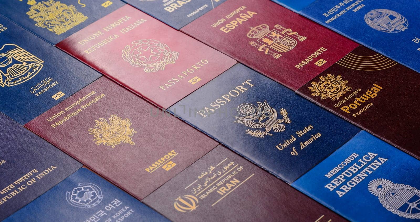 Passports of citizens of different countries of the world, background consisting of passports of several countries.