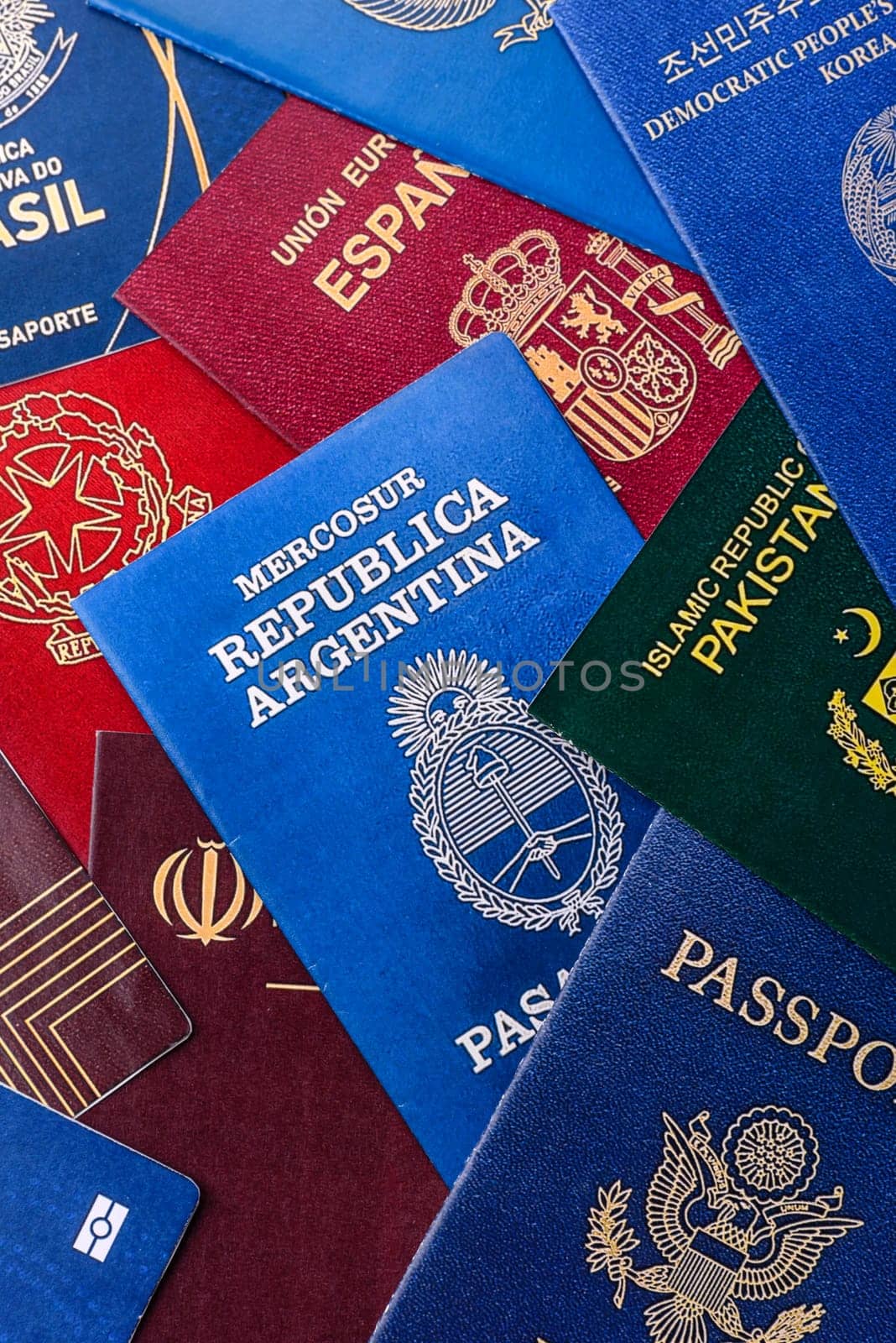 Passports of citizens of different countries of the world, background consisting of passports of several countries.