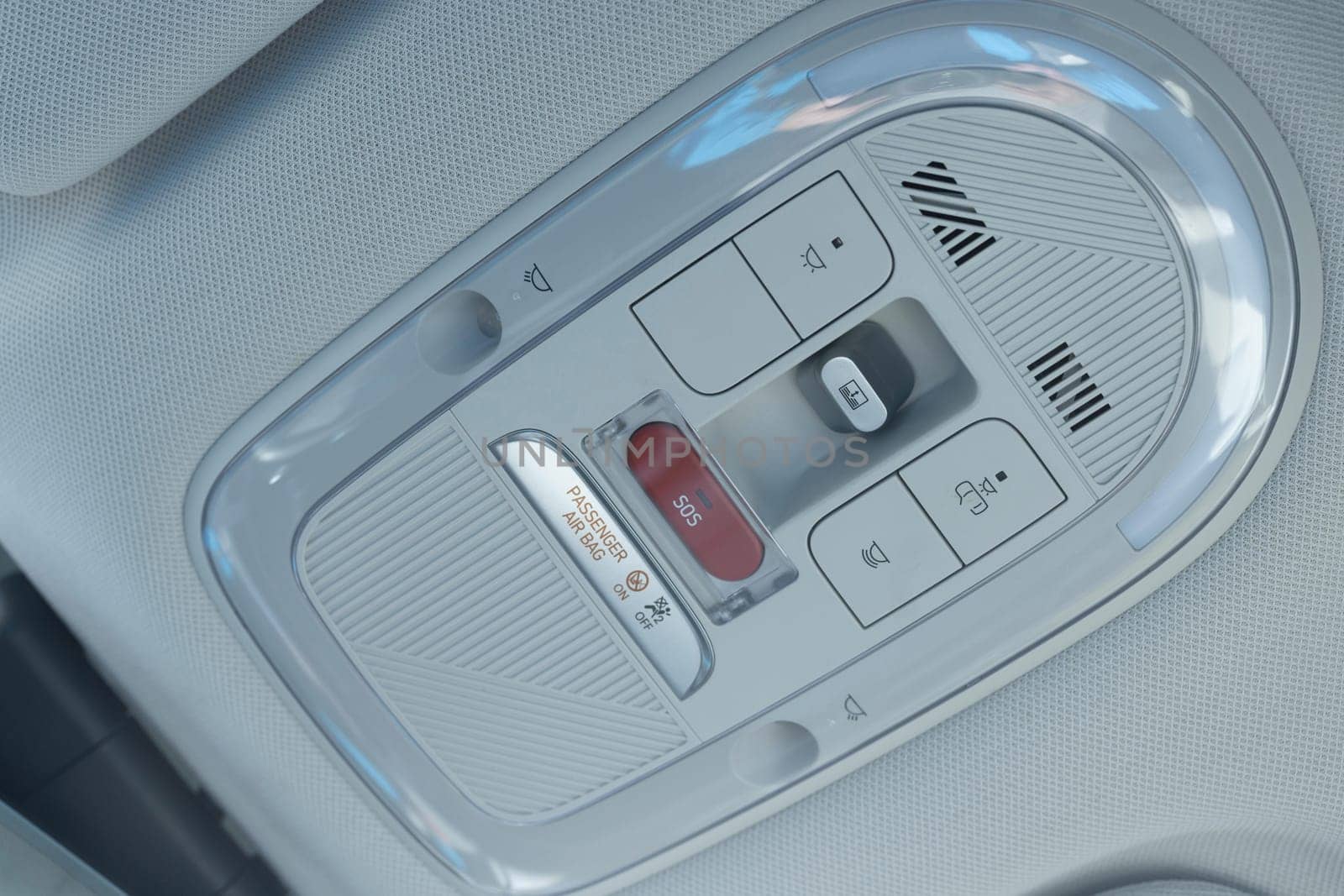 Emergency sos button to contact with call center to ask for help after car accident. SOS button in a car as a symbol for the eCall system in European cars.