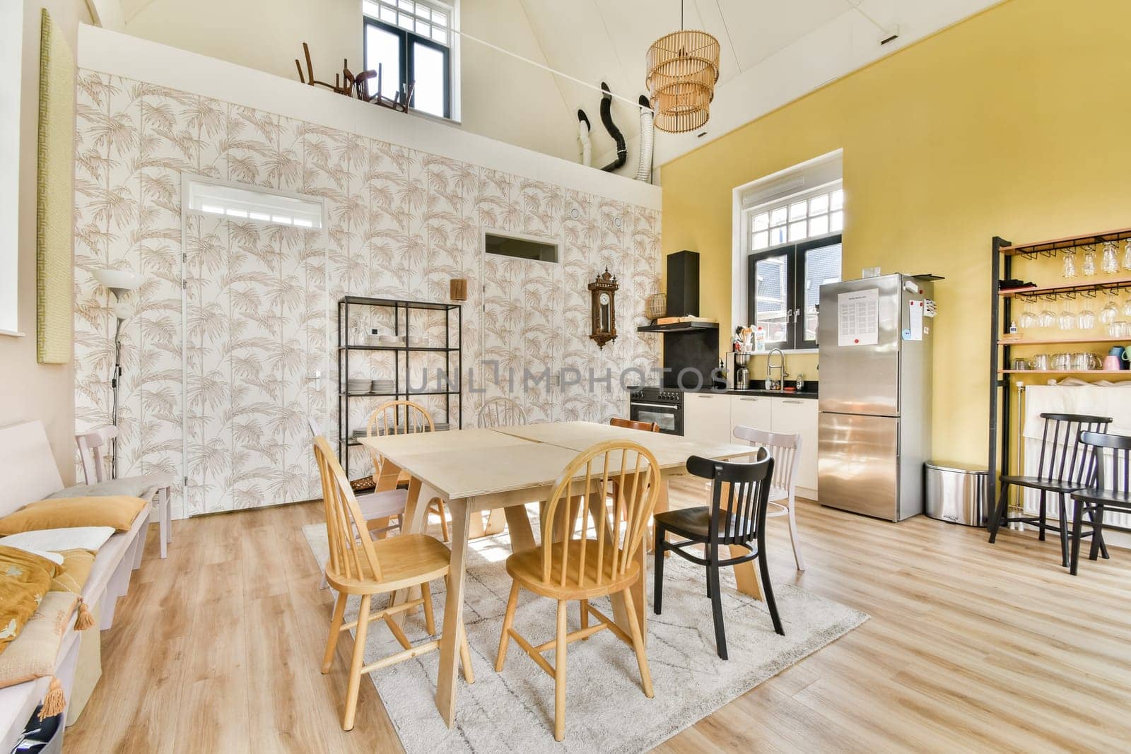 A modern dining area featuring elegant wooden furniture, stylish decor, and a warm color scheme, perfect for family gatherings or entertaining guests.