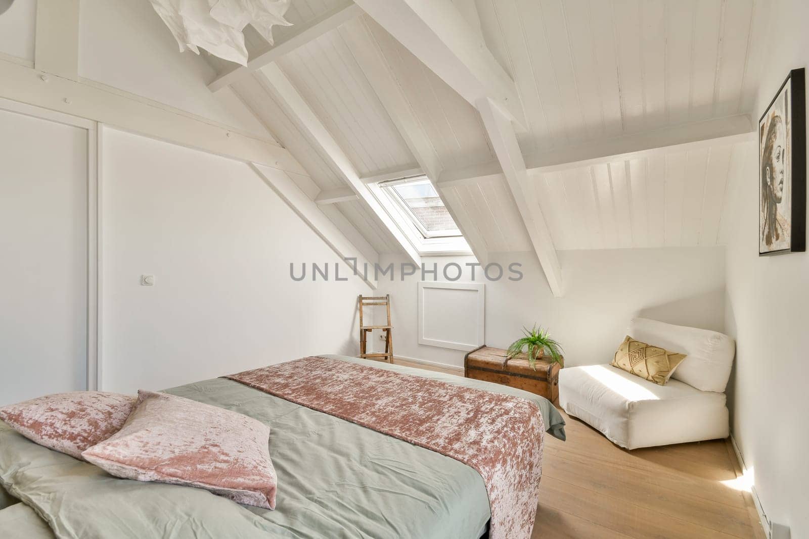A beautifully designed minimalist bedroom showcasing elegant furnishings, soft tones, and ample natural light. Ideal for relaxation and style.