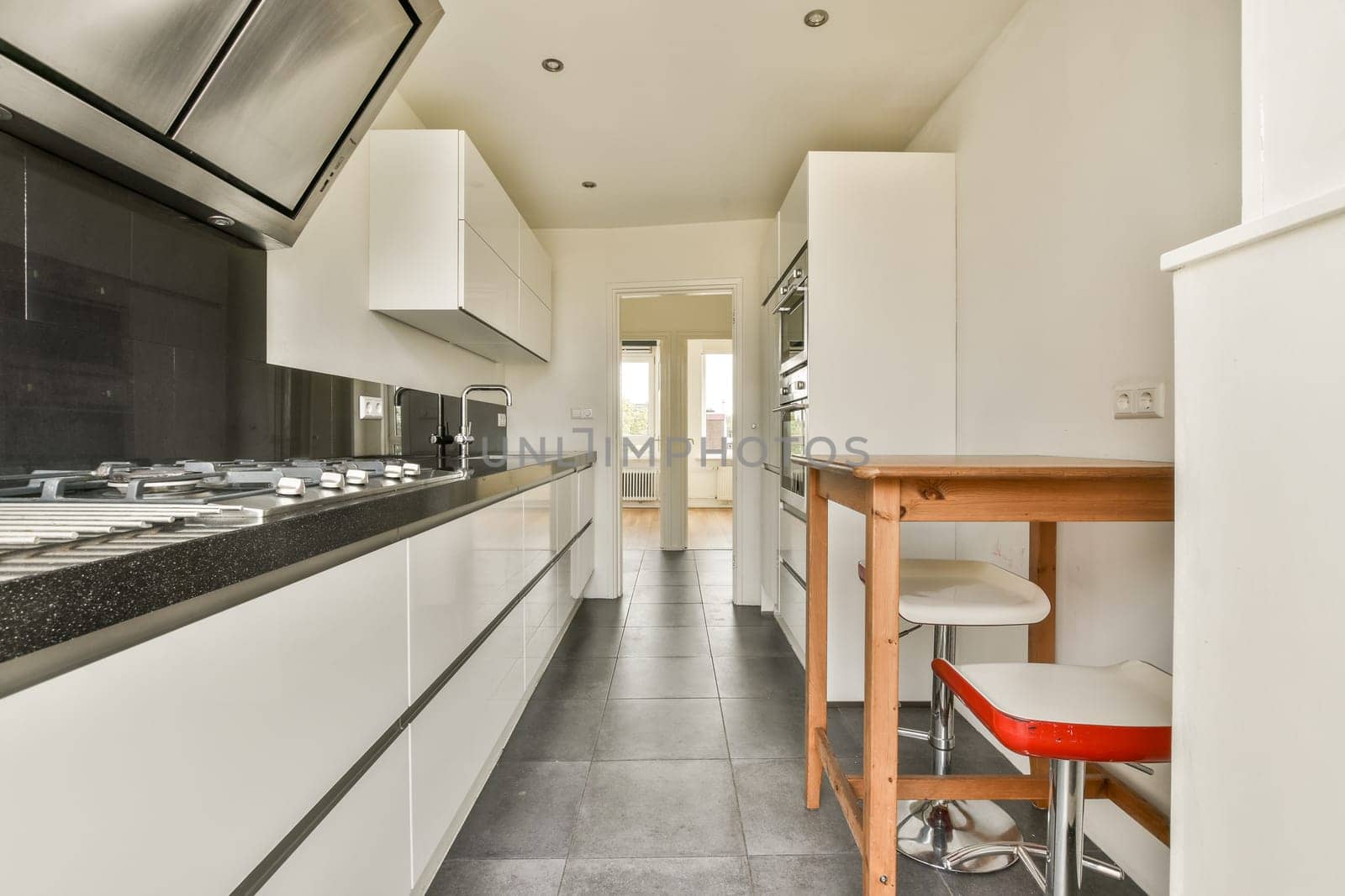A sleek and functional kitchen featuring contemporary cabinetry, clean lines, and a blend of white and black tones for a modern aesthetic.