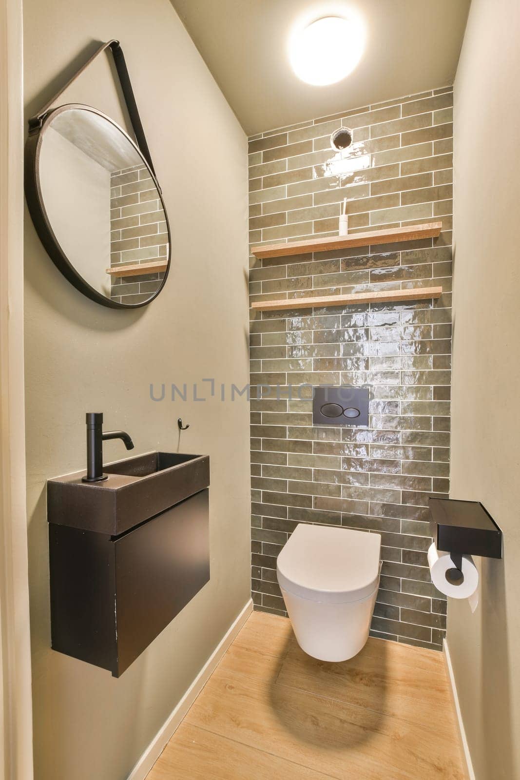 A sleek and contemporary bathroom featuring elegant fixtures and a minimalist aesthetic. The design highlights the interplay of materials and light.