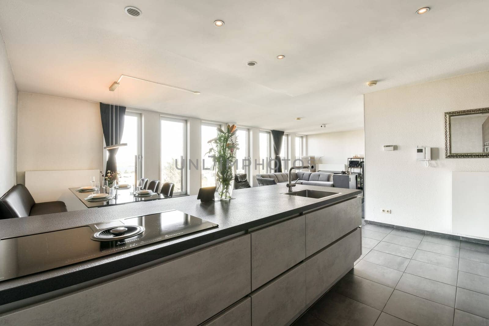 Contemporary kitchen showcasing sleek cabinetry, elegant finishes, and ample natural light, perfect for culinary creativity and social gatherings.