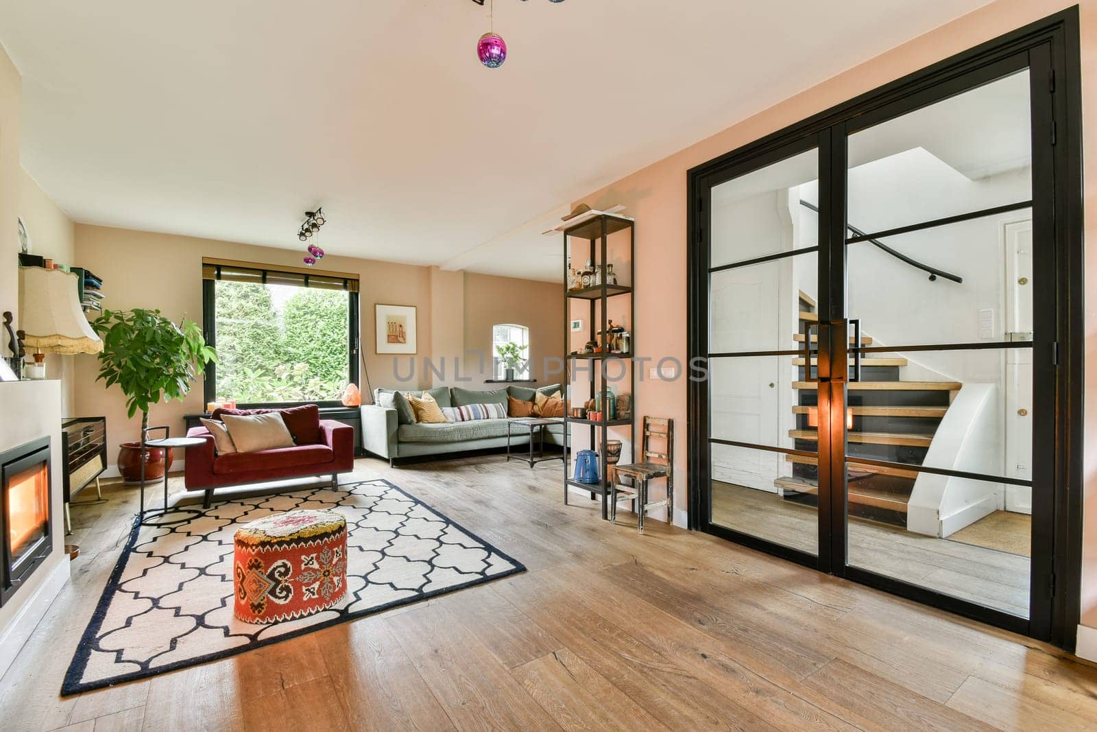 A beautifully designed modern living room featuring cozy furniture, warm lighting, and an inviting atmosphere, perfect for relaxation and socializing.
