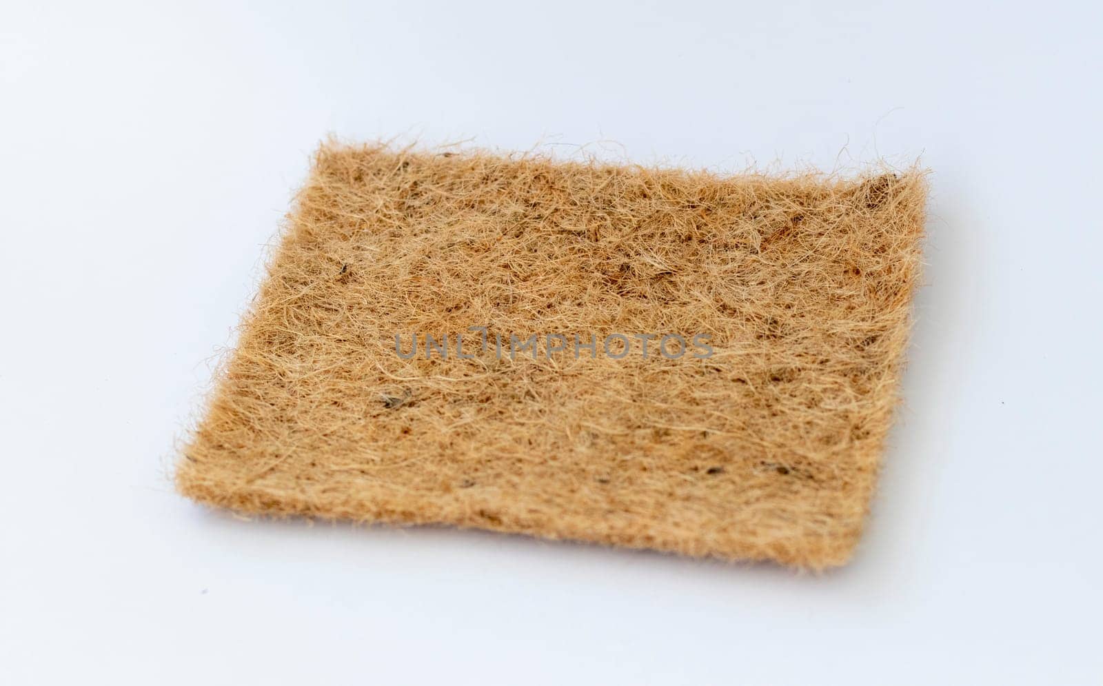 Close up shot of the jute mat used for growing micro greens on the white background