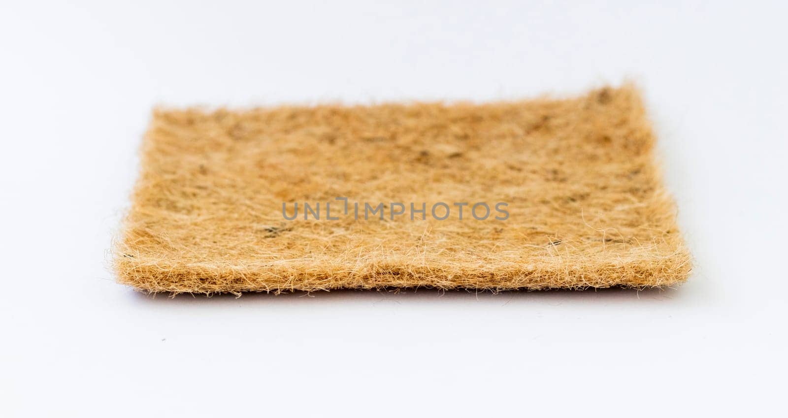 Close up shot of the jute mat used for growing micro greens on the white background
