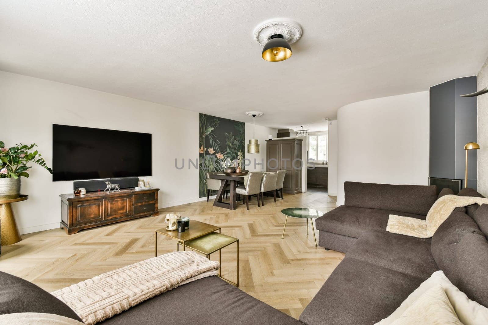 Stylish modern living room featuring a neutral color palette, elegant furniture, and a decorative wall. Perfect for contemporary home aesthetics.