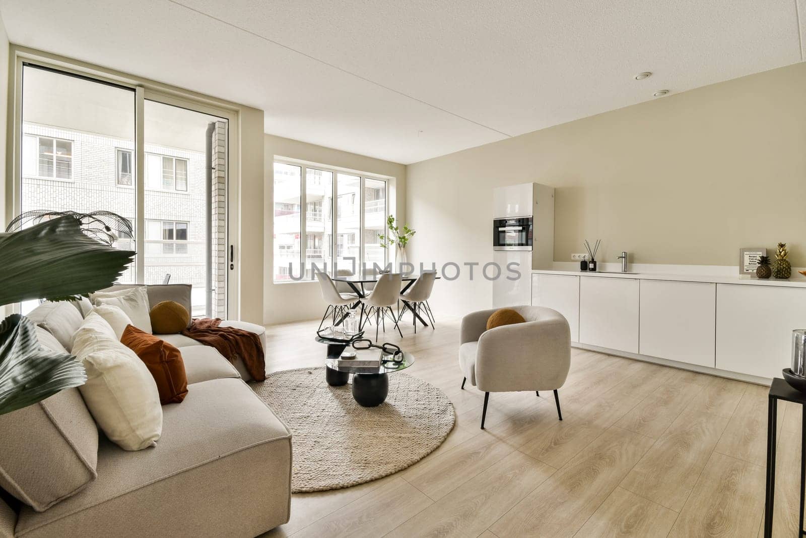 A cozy modern living room featuring a bright and airy atmosphere with stylish furniture, soft textiles, and contemporary decor elements creating a welcoming space.