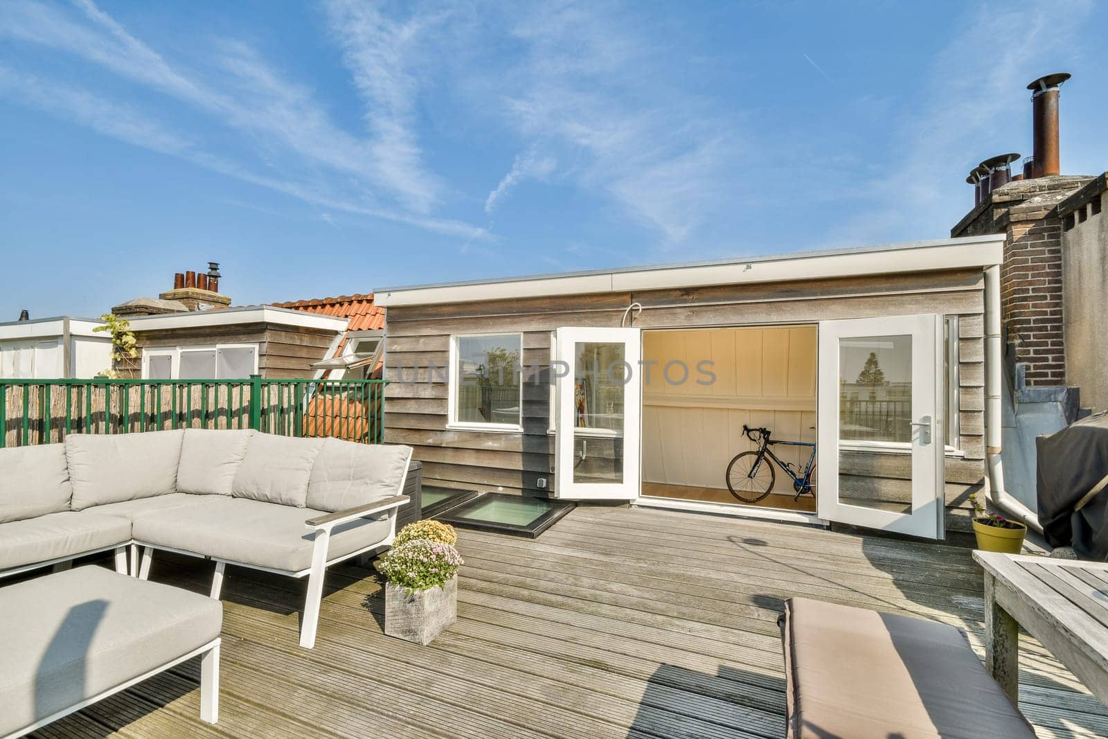 A contemporary outdoor area featuring a comfortable seating arrangement, blending modern design with natural surroundings for relaxation and social gatherings.