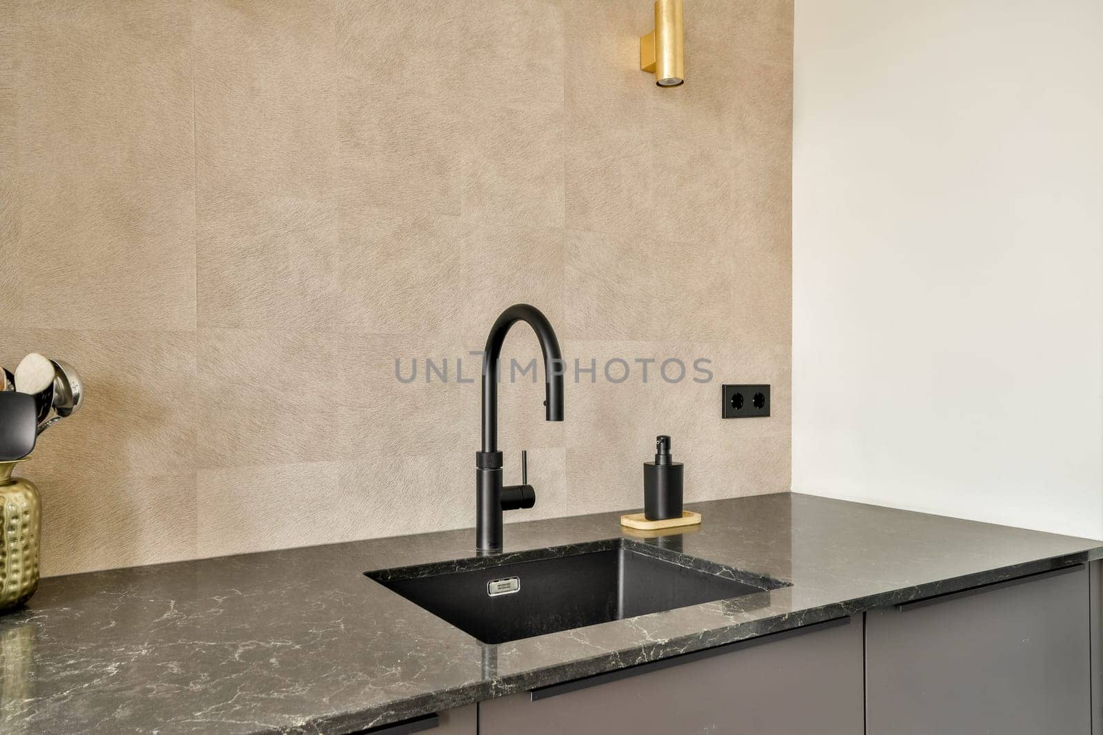 The image features a sleek modern kitchen sink with a black faucet and elegant marble countertop, presenting a contemporary aesthetic in interior design.