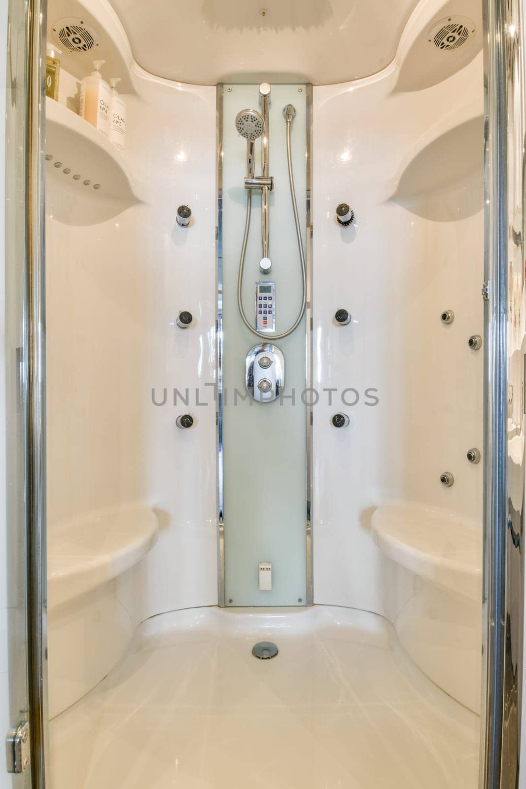 Sleek and contemporary shower design showcasing multiple showerheads and a clean, minimalistic aesthetic. Ideal for modern bathrooms.