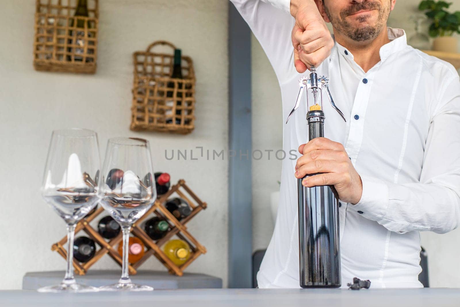 Opening a bottle of wine. Selective focus. drink.