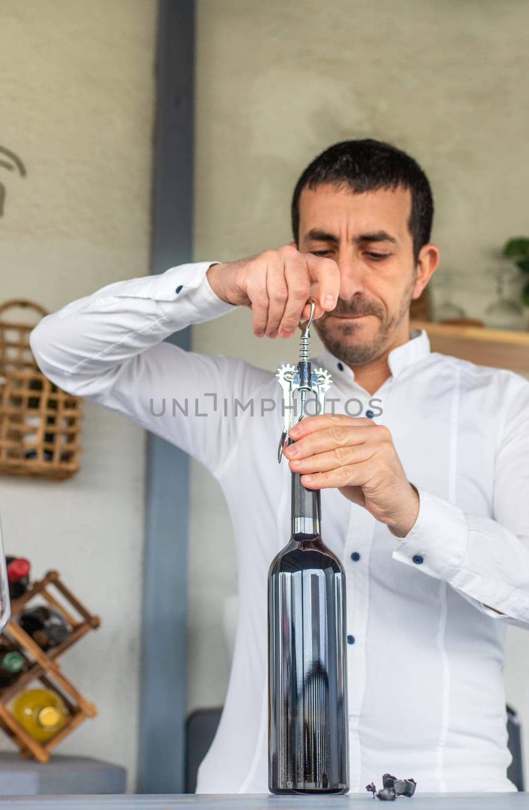 Opening a bottle of wine. Selective focus. drink.