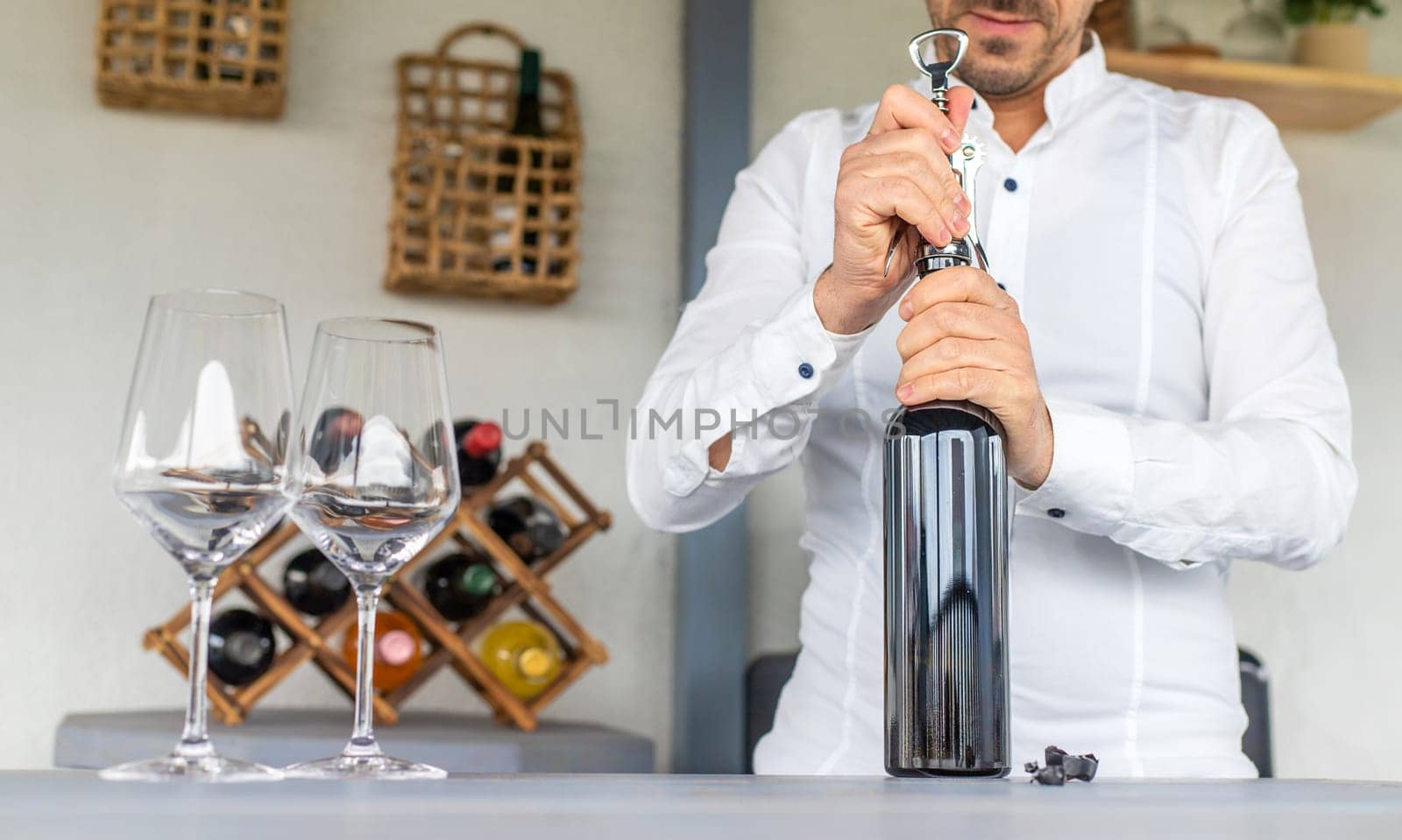 Opening a bottle of wine. Selective focus. drink.