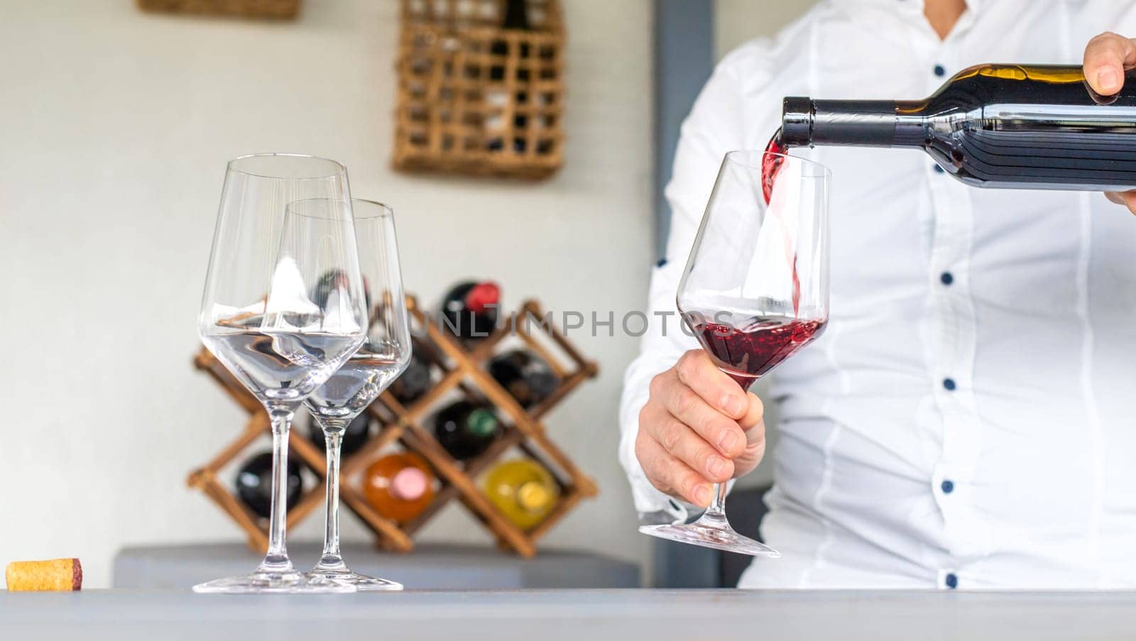 Glass of red wine in hands. Selective focus. drink.