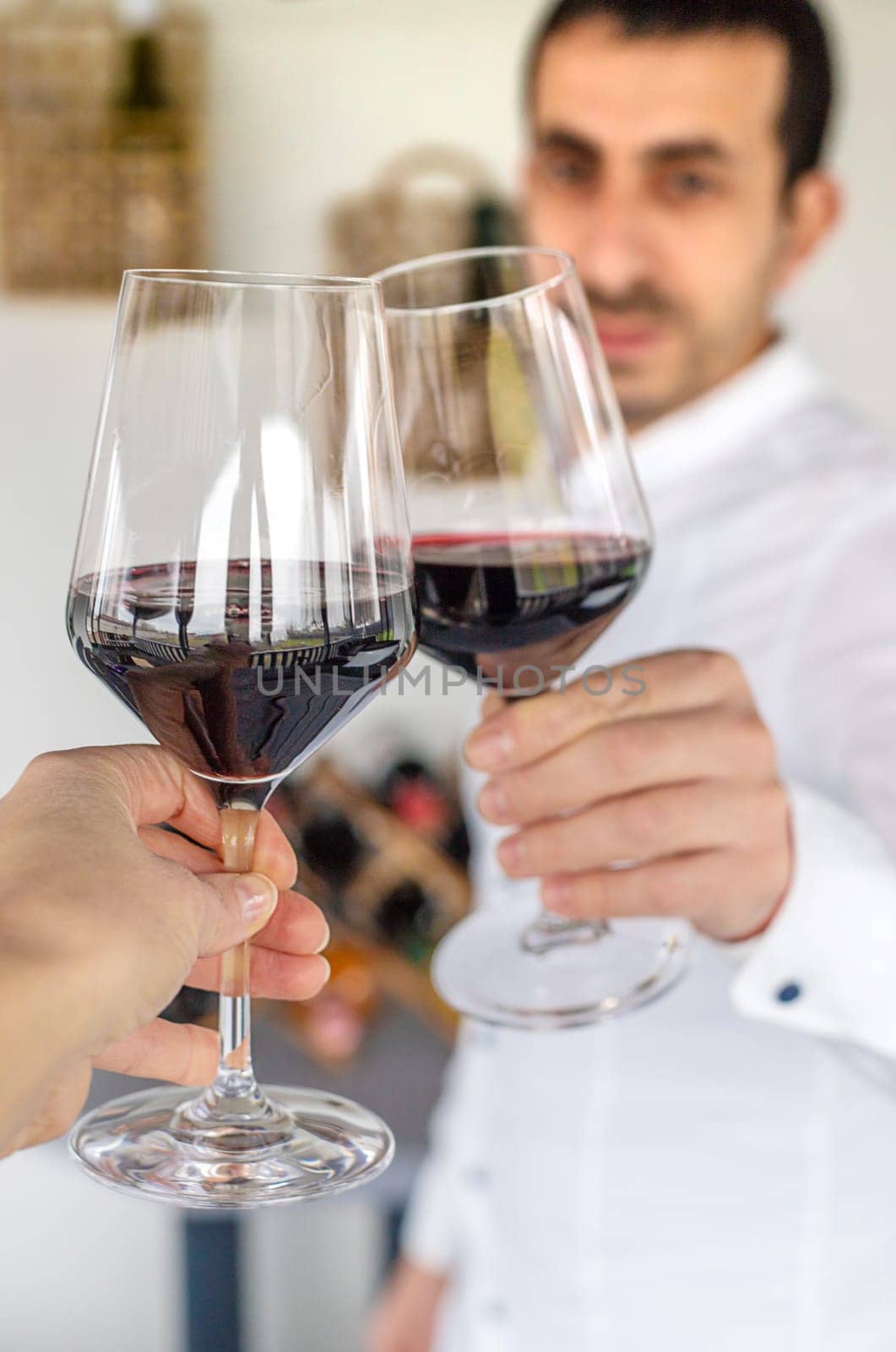 Glass of red wine in hands. Selective focus. drink.