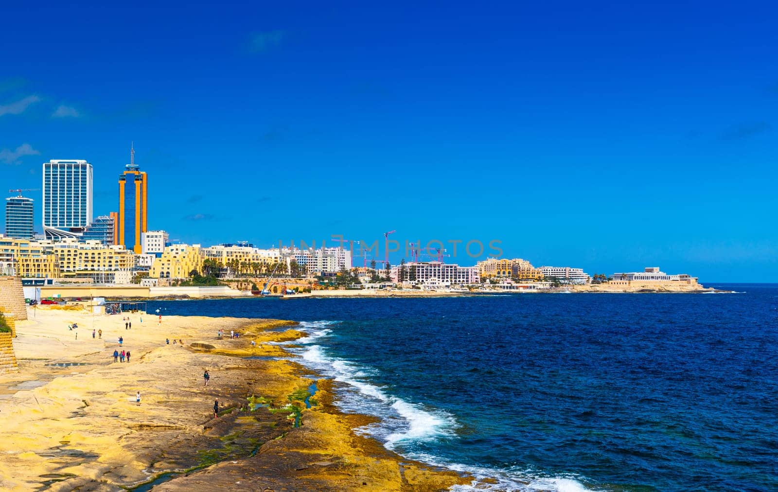 View of the coastline in Sliema, skyscrapers in Paceville district, Malta.