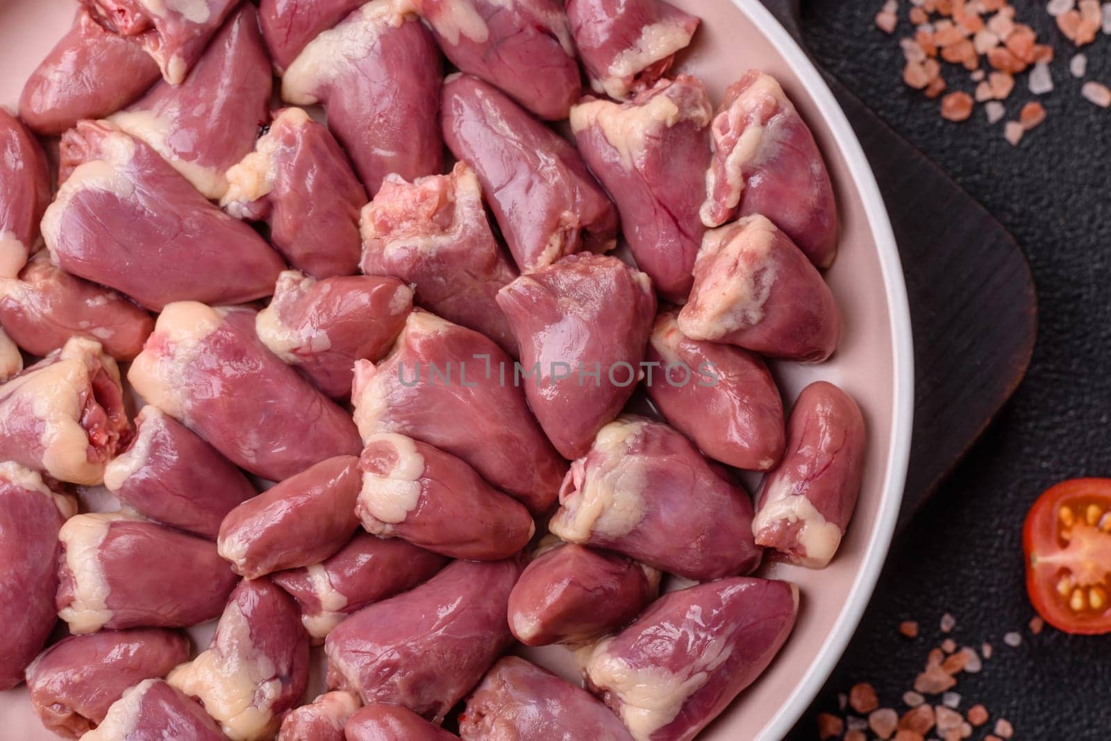 Chicken raw heart, red duck or turkey internal organs as an ingredient for dinner preparation
