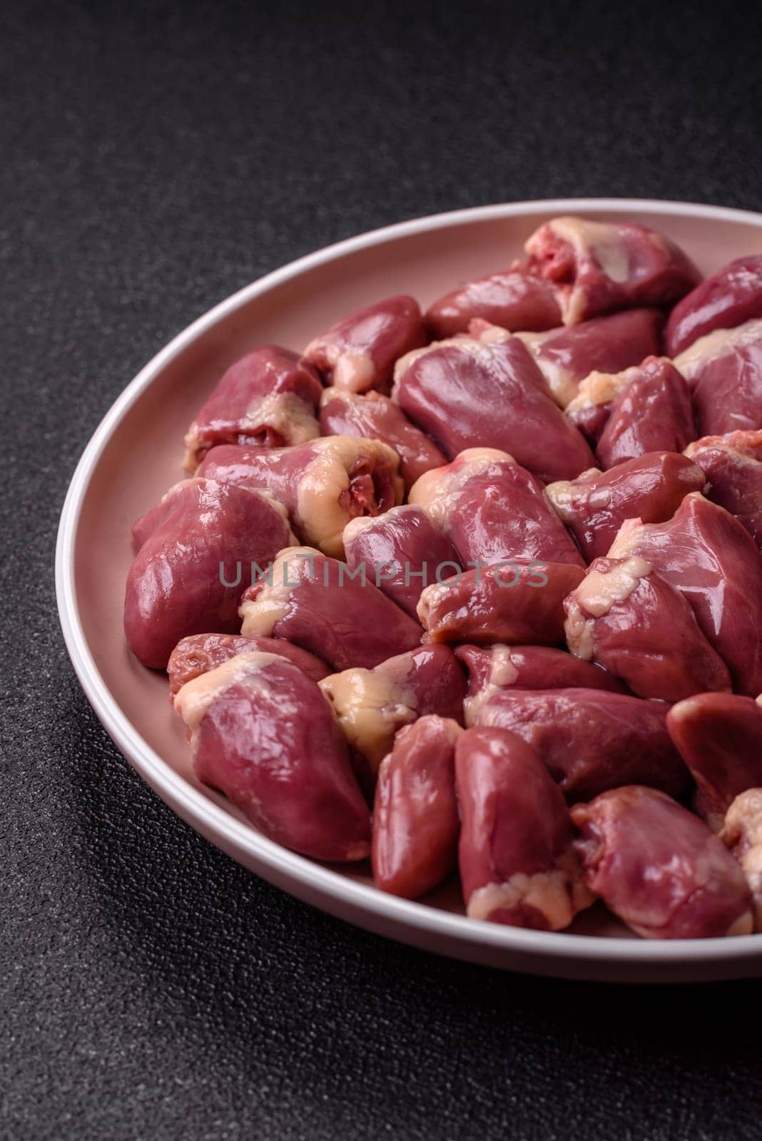 Chicken raw heart, red duck or turkey internal organs as an ingredient for dinner preparation