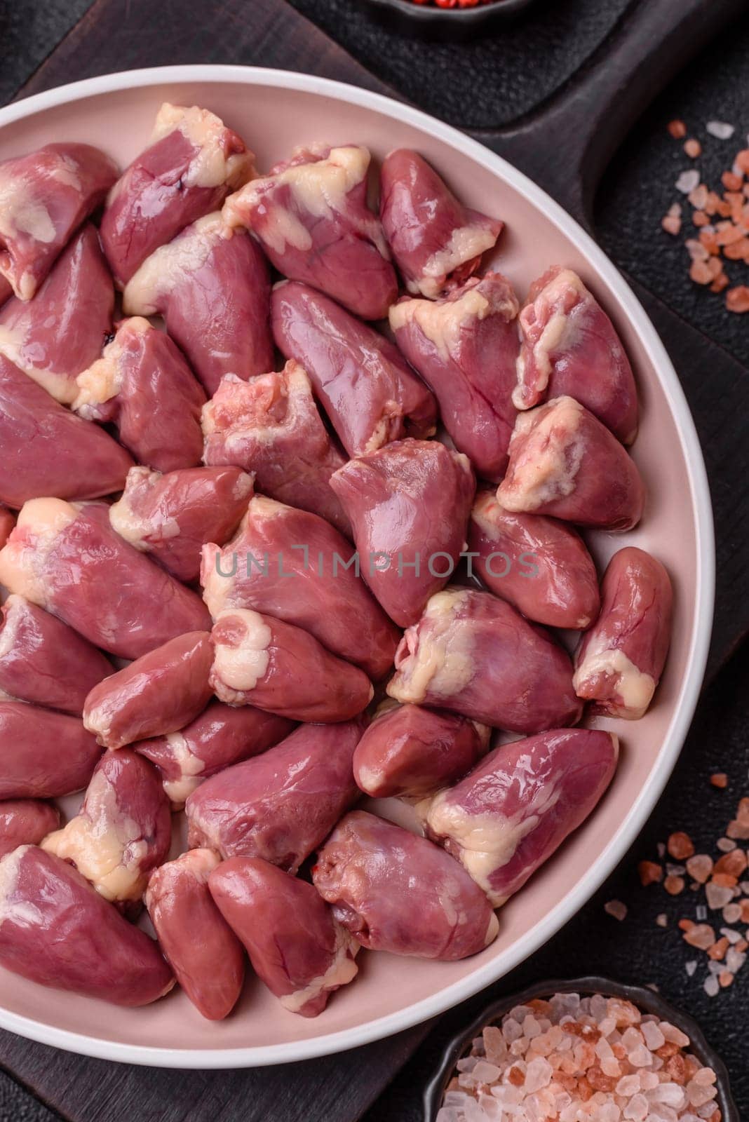 Chicken raw heart, red duck or turkey internal organs as an ingredient for dinner preparation