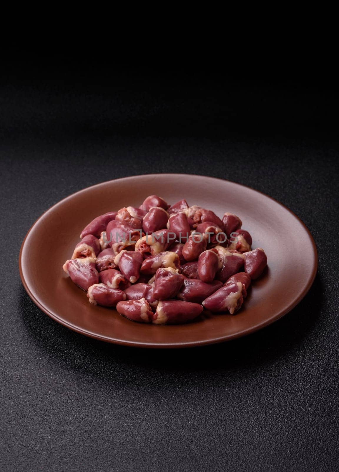 Chicken raw heart, red duck or turkey internal organs as an ingredient for dinner preparation