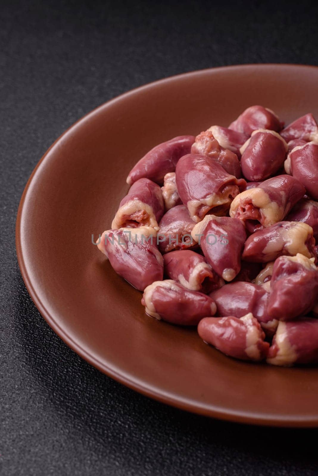 Chicken raw heart, red duck or turkey internal organs as an ingredient for dinner preparation