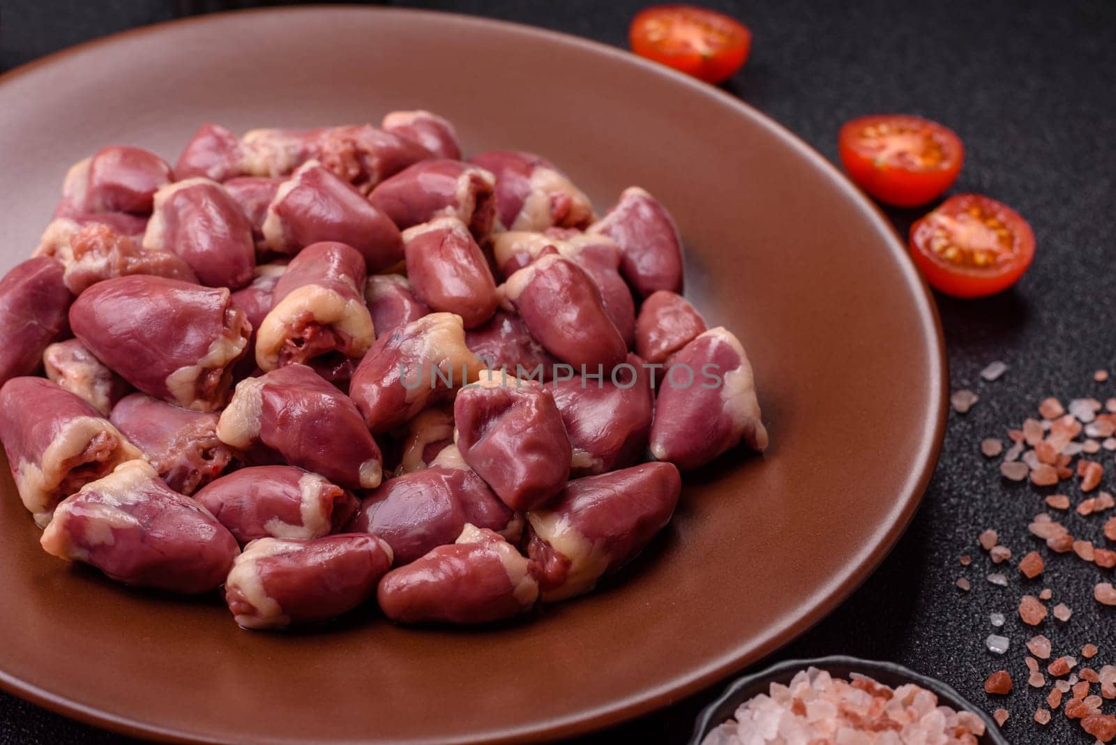 Chicken raw heart, red duck or turkey internal organs as an ingredient for dinner preparation