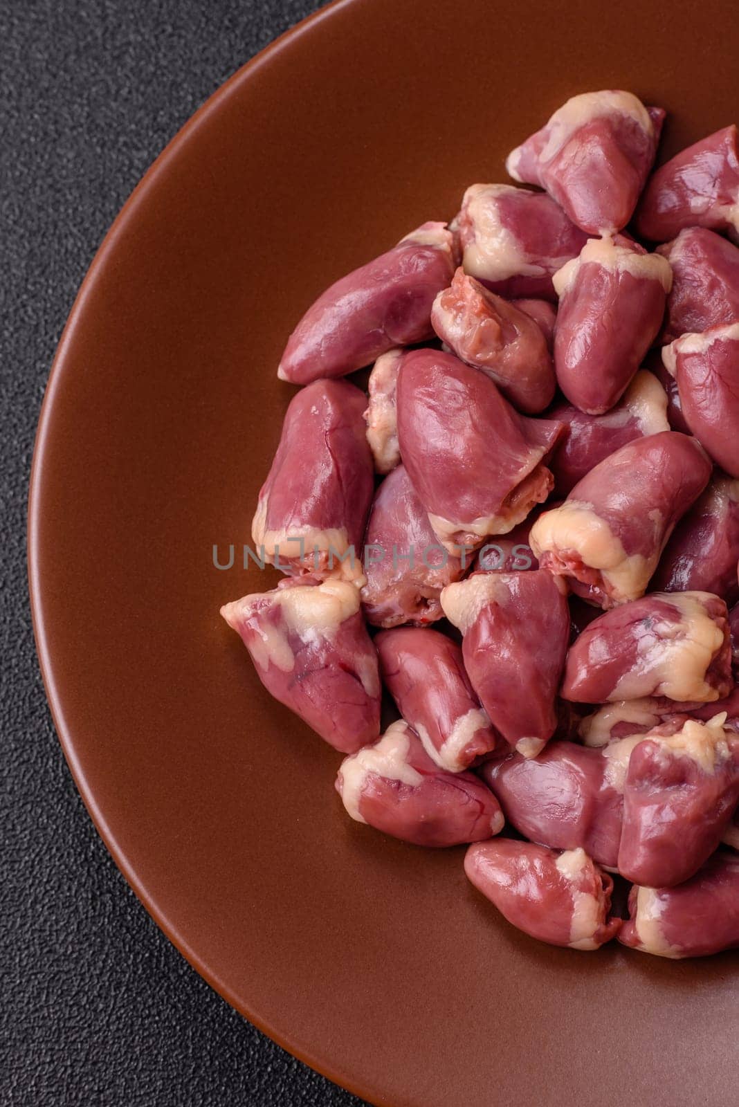 Chicken raw heart, red duck or turkey internal organs as an ingredient for dinner preparation