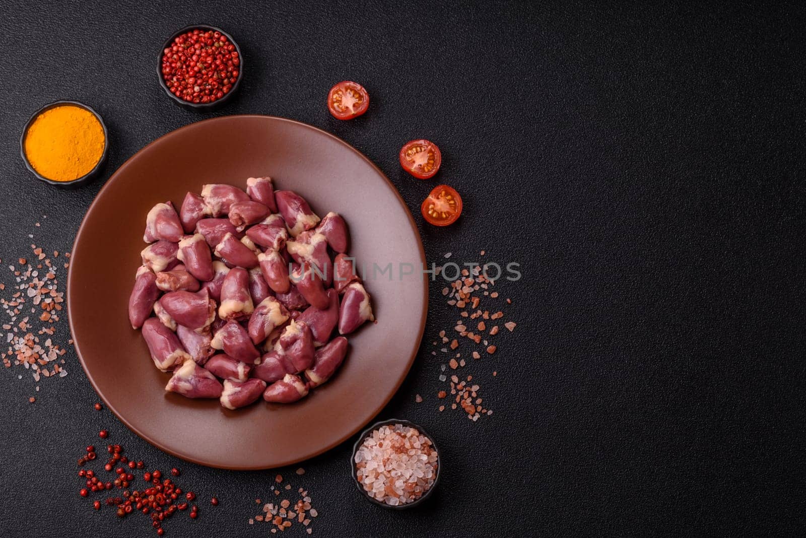 Chicken raw heart, red duck or turkey internal organs as an ingredient for dinner preparation